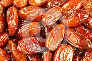 Dried dates situated arbitrarily. Food background