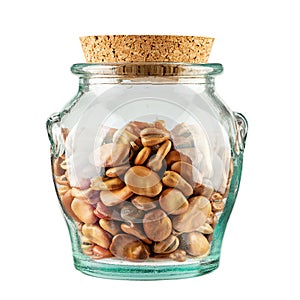 Dried Fava Beans, Broad Beans in Glass Jar isolated on white background