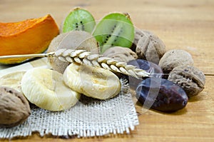 Dried figs, palms, pumpkins, wheat with walnuts and kiwis