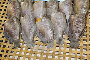 Dried fish on bamboo basket.