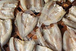 Dried fish on Bamboo sieve with sunny