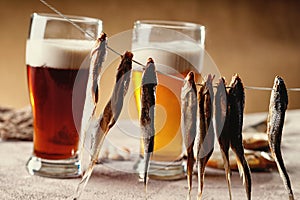 Dried fish and beer on the table
