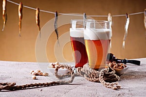Dried fish and beer on the table