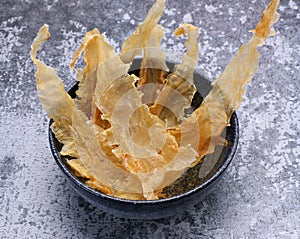 Dried fish maw on wooden table. photo