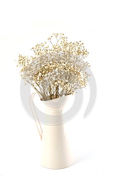 Dried flower bouquet in metal vase with white background