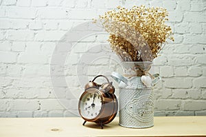 Dried flower in metal vase with space copy on white brick wall background