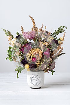 Dried flowers arrangement. Sustainable floristry. Home decor with dried flowers. photo