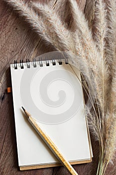 Dried flowers and small notepad