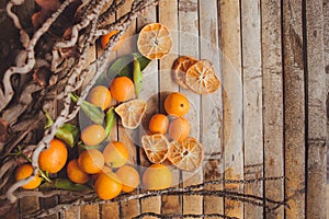 Dried and fresh mandarin (tangerine) wood board rustic style