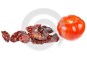 Dried and fresh tomatoes isolated on white