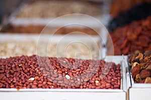 Dried fruit background. Rows of dried dates, apricots, nuts, prunes.