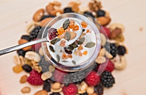 Dried fruit mix raspberry, mixed nuts and yogurt.