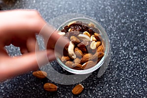 Dried fruit and nuts on a hand