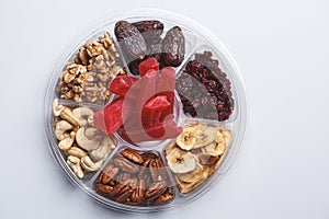 Dried fruits and nuts on a plate to celebrate the Jewish holiday Tu Bi Shevat