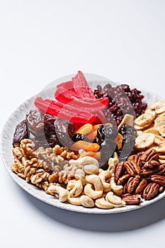 Dried fruits and nuts on a plate to celebrate the Jewish holiday Tu Bi Shvat