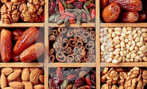 Dried fruits, various nuts and seeds in wooden box