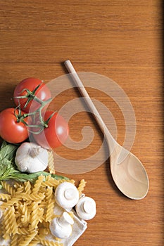 Dried fusilli pasta with tomatoes, basil and garlic