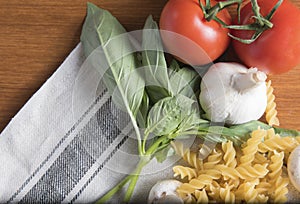 Dried fusilli pasta with tomatoes, basil and garlic