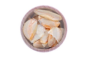 Dried garlic flakes in wooden bowl