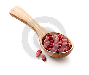 Dried goji berries or chinese wolfberries in a wooden spoon