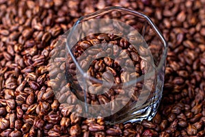 Dried grape seed seeds in a glass cup on the background of a placer