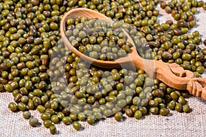 Dried green azuki beans with wooden spoon