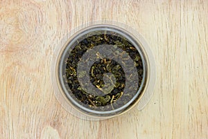 Dried green tea in glass jar