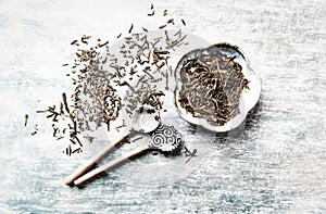 Dried Green Tea Leaves on Bright Background. Top view.