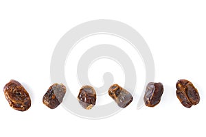 Dried halawi dates on a white