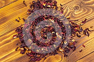 Dried hibiscus carcade, roselle on wooden table