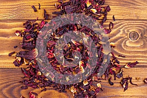 Dried hibiscus carcade, roselle on wooden table