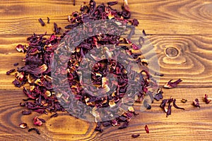 Dried hibiscus carcade, roselle on wooden table