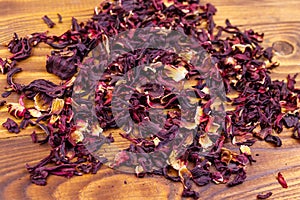 Dried hibiscus carcade, roselle on wooden table