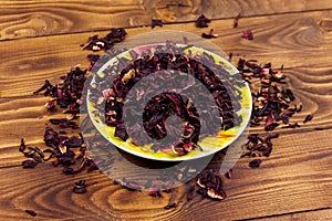 Dried hibiscus carcade, roselle on wooden table