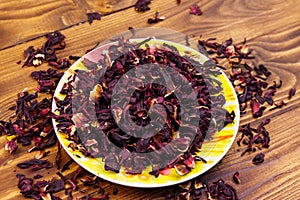 Dried hibiscus carcade, roselle on wooden table