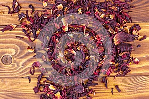 Dried hibiscus carcade, roselle on wooden table