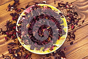 Dried hibiscus carcade, roselle on wooden table