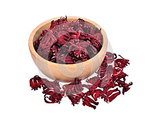 Dried hibiscus sabdariffa or roselle fruits in wooden bowl