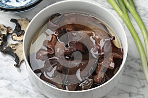 Dried jews ear mushrooms soaking in a bowl photo