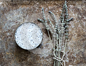 Dried lavender flatlay on rustic background with bathsalt