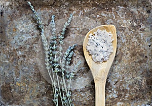 Dried lavender flatlay on rustic background with bathsalt in a spoon