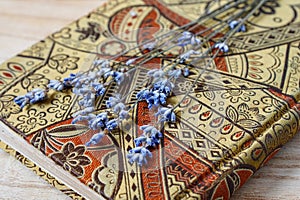 Dried lavender flowers over beautiful diary