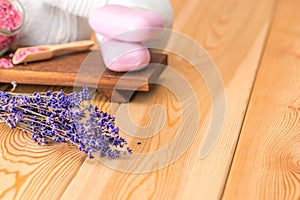 Dried lavender and soap with natural lavender extract for spa treatments and relaxation on wooden boards