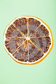 Dried lemon slice isolated on blue background