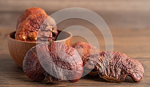 Dried lingzhi mushroom on wooden background
