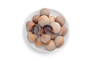 Dried longan in a white plate