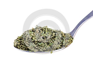 Dried lovage in a spoon