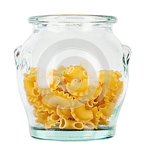 Dried macaroni cockerel scallops. Pasta in a glass jar isolated on a white background