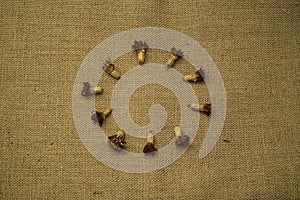 Dried marigold flowers on burlap background
