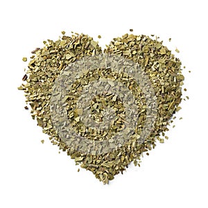 Dried Mate tea leaves in hearts shape close up